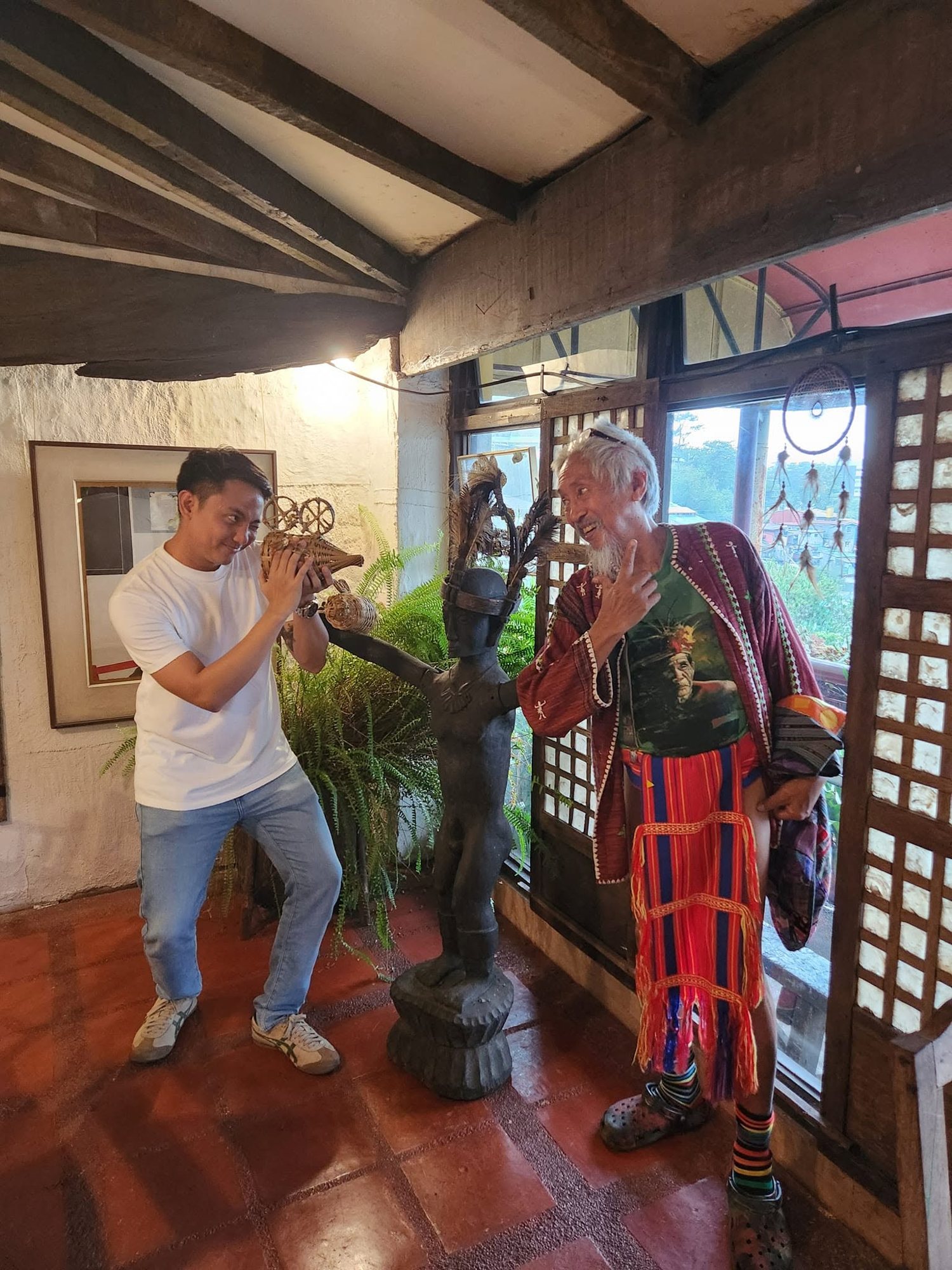 Crew framing a shot with a local artisan