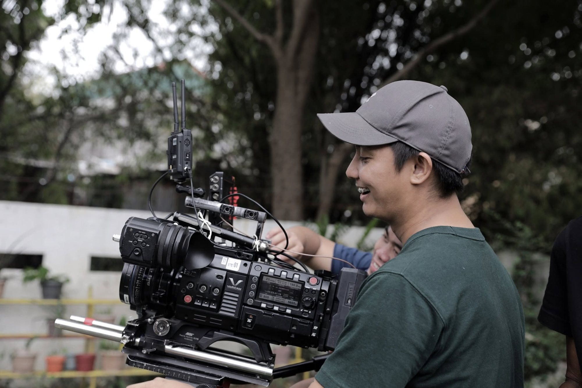 Privado cinematographer operating a cinema camera on location